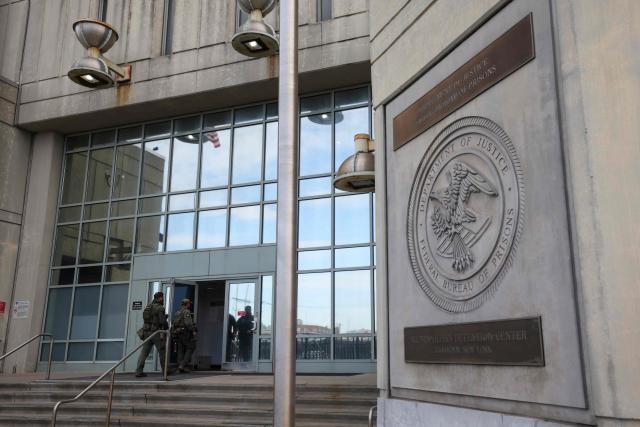 Agents with the Federal Bureau of Prisons enter the Metropolitan Detention Center on the eve of ousted Venezuelan president Nicolas Maduro's scheduled court appearance in New York on March 25, 2026. Lawyers for the ousted Venezuelan president Nicolas Maduro are expected to push for the dismissal of his drug trafficking charges when he appears in a New York court on March 26. The Manhattan hearing comes as Washington cautiously warms ties with Caracas, with the question of who will pay the legal fees of the former autocrat and his wife expected to take center stage. (Photo by ANGELA WEISS / AFP)