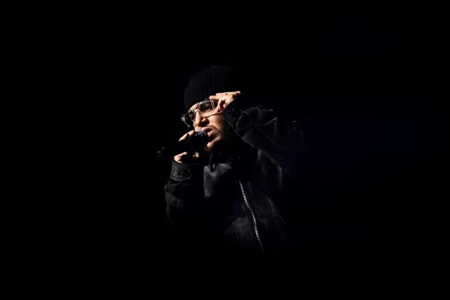 Belgian rapper Hamza performs on stage during a concert in tribute to French late rapper Werenoi at the Accor Arena in Paris on March 25, 2026. (Photo by JULIEN DE ROSA / AFP)