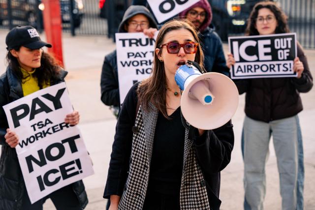 People protest ICE presence outside Terminal 4 at John F. Kennedy International Airport in New York, on March 25, 2026. US Immigration and Customs Enforcement (ICE) at the center of a firestorm over heavy-handed enforcement tactics began deploying Monday to major airports, as officials scrambled to ease mounting travel disruption during a prolonged, partial government shutdown. (Photo by Angelina Katsanis / AFP)