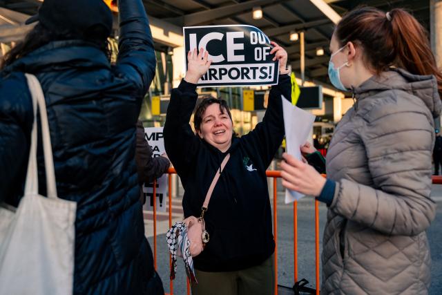 People protest ICE presence outside Terminal 4 at John F. Kennedy International Airport in New York, on March 25, 2026. US Immigration and Customs Enforcement (ICE) at the center of a firestorm over heavy-handed enforcement tactics began deploying Monday to major airports, as officials scrambled to ease mounting travel disruption during a prolonged, partial government shutdown. (Photo by Angelina Katsanis / AFP)