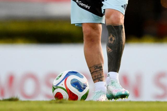 The tattooed legs of Argentina's forward Lionel Messi are pictured during a training session in Ezeiza, Buenos Aires province, Argentina on March 25, 2026. Argentina will play a friendly match against Mauritania on March 27 at the La Bombonera Stadium in Buenos Aires. (Photo by Luis ROBAYO / AFP)