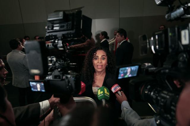 Peru's presidential candidate Rosario Fernandez, for the Un Camino Diferente party, speaks to the media as she arrives at the third round of debates on tackling crime and corruption at the Lima Convention Center in Lima on March 25, 2026. Peru will hold presidential elections on April 12. (Photo by Connie FRANCE / AFP)
