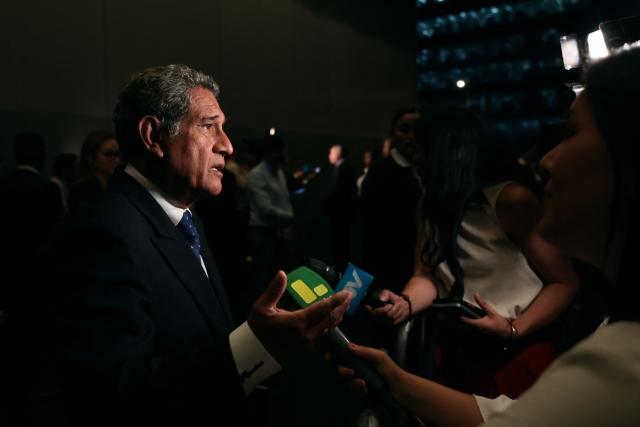 Peru's presidential candidate Mesias Guevara, for the Morado party, speaks to the media as he arrives at the third round of debates on tackling crime and corruption at the Lima Convention Center in Lima on March 25, 2026. Peru will hold presidential elections on April 12. (Photo by Connie FRANCE / AFP)