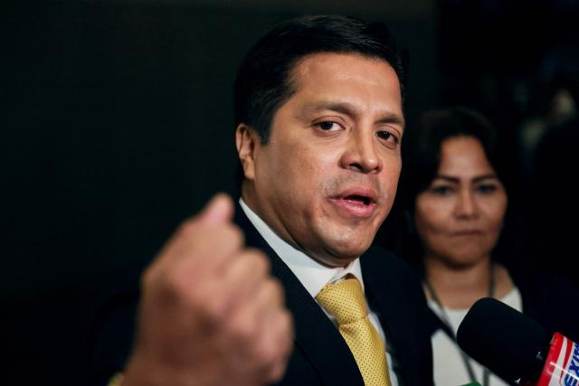 Peru's presidential candidate Paul Jaimes, for the Progresemos party, speaks to the media as he arrives at the third round of debates on tackling crime and corruption at the Lima Convention Center in Lima on March 25, 2026. Peru will hold presidential elections on April 12. (Photo by Connie FRANCE / AFP)