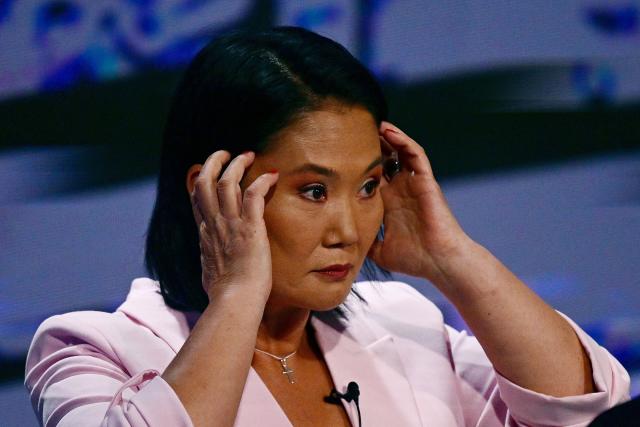 Peru's presidential candidate Keiko Fujimori, for the Fuerza Popular party, gestures during the third round of debates on tackling crime and corruption at the Lima Convention Center in Lima on March 25, 2026. Peru will hold presidential elections on April 12. (Photo by ERNESTO BENAVIDES / AFP)