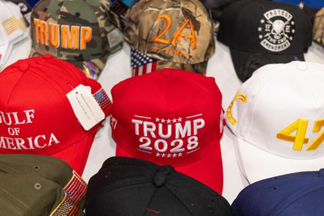 Trump-themed merchandise is displayed during the Conservative Political Action Conference at the Gaylord Texan Resort & Convention Center, in Grapevine, Texas, in March 25, 2026. American conservatives converge on Texas this week for what organizers bill as their largest and most influential gathering, with the Iran war and fears of a punishing midterm election cycle heightening the stakes. (Photo by Leandro Lozada / AFP)