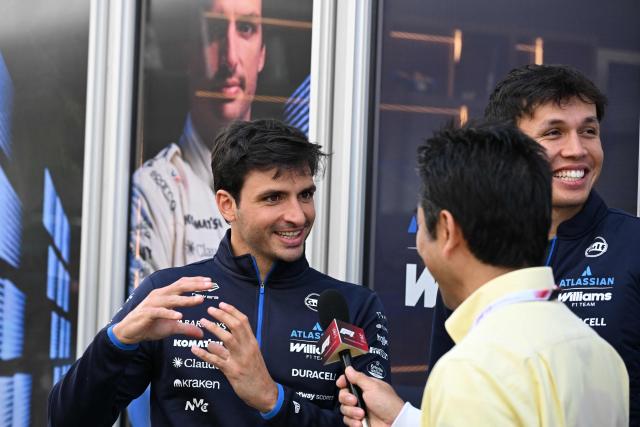 Williams' Spanish driver Carlos Sainz is interviewed with his Thai teammate Alexander Albon (R) ahead of the March 29 Formula One Japanese Grand Prix race at the Suzuka circuit in Suzuka, Mie prefecture on March 26, 2026. (Photo by Toshifumi KITAMURA / AFP)