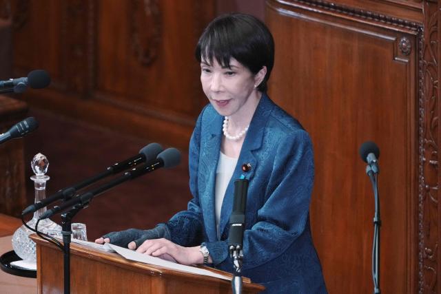 Japan's Prime Minister Sanae Takaichi answers questions from an opposition lawmaker regarding her report on the results of her recent visit to the United States during a plenary session of the House of Representatives at Parliament in Tokyo on March 26, 2026. (Photo by Kazuhiro NOGI / AFP)