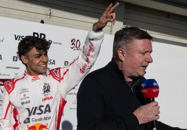 Racing Bulls` British driver Arvid Lindbald jokes around with a reporter ahead of the Formula 1 Japanese Grand Prix in Suzuka on March 26, 2026. (Photo by ANDREW CABALLERO-REYNOLDS / AFP)