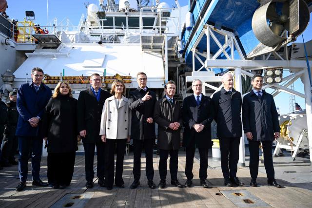 (L-R) Danish Permanent Under-Secretary of State for Foreign Affairs Anders Tang Friborg, Latvian Prime Minister Evika Silina, Estonian Prime Minister Kristen Michal, Icelandic Prime Minister Kristrun Frostadottir, Finnish President Alexander Stubb, Swedish Prime Minister Ulf Kristersson, British Prime Minister Keir Starmer, Norwegian Prime Minister Jonas Gahr Store and Dutch Prime Minister Rob Jetten pose for a group photo onboard the Finnish Border Guard offshore patrol vessel Turva prior the Joint Expeditionary Force JEF Leaders Summit in Helsinki, Finland on March 26, 2026. The topics on the agenda include support from the JEF countries to Ukraine and the overall security situation in Europe. (Photo by Heikki Saukkomaa / Lehtikuva / AFP) / Finland OUT