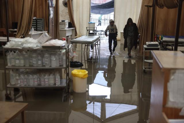 Floodwater covers the floor of an emergency field tent belonging to Nasser Hospital, which serves as the outpatient reception and emergency department, following heavy rain in Khan Yunis in the southern Gaza Strip on March 26, 2026. Violence has persisted in Gaza despite a ceasefire which came into effect on October 10, with both Israel and Hamas regularly accusing each other of violations. (Photo by Bashar Taleb / AFP)