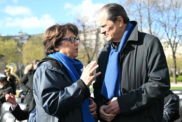 Former Minister and former First Secretary of the Socialist Party Martine Aubry (L) and Former First Secretary of the Socialist Party Jean-Christophe Cambadélis arrive at a national tribute to former French Prime Minister Lionel Jospin at the Hotel des Invalides in Paris on March 26, 2026. Born on July 12, 1937, former French prime minister Lionel Jospin, a Socialist who introduced the 35-hour work week and civil partnerships for gay couples, has died aged 88, his family said on March 23, 2026. (Photo by Bertrand GUAY / AFP)