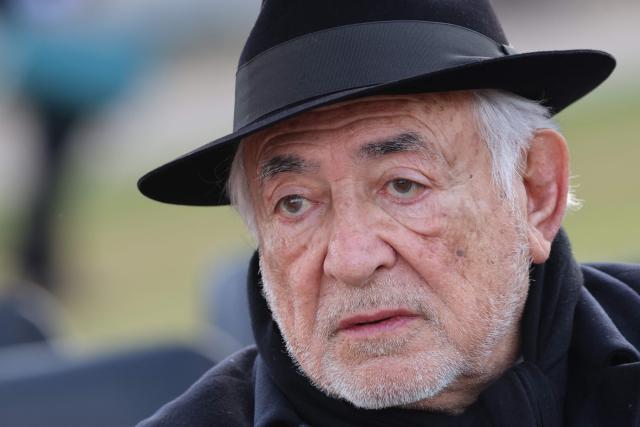 Former French Minister and International Monetary Fund's chairman Dominique Strauss-Kahn arrives at a national tribute to former French Prime Minister Lionel Jospin at the Hotel des Invalides in Paris on March 26, 2026. Born on July 12, 1937, former French prime minister Lionel Jospin, a Socialist who introduced the 35-hour work week and civil partnerships for gay couples, has died aged 88, his family said on March 23, 2026. (Photo by Ludovic MARIN / AFP)