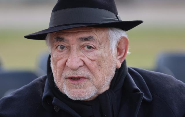 Former French Minister and International Monetary Fund's chairman Dominique Strauss-Kahn arrives at a national tribute to former French Prime Minister Lionel Jospin at the Hotel des Invalides in Paris on March 26, 2026. Born on July 12, 1937, former French prime minister Lionel Jospin, a Socialist who introduced the 35-hour work week and civil partnerships for gay couples, has died aged 88, his family said on March 23, 2026. (Photo by Ludovic MARIN / AFP)
