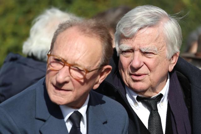 Former Minister Jean Glavany (R) and Former mayor of Paris Bertrand Delanoë arrive at a national tribute to former French Prime Minister Lionel Jospin at the Hotel des Invalides in Paris on March 26, 2026. Born on July 12, 1937, former French prime minister Lionel Jospin, a Socialist who introduced the 35-hour work week and civil partnerships for gay couples, has died aged 88, his family said on March 23, 2026. (Photo by Ludovic MARIN / AFP)