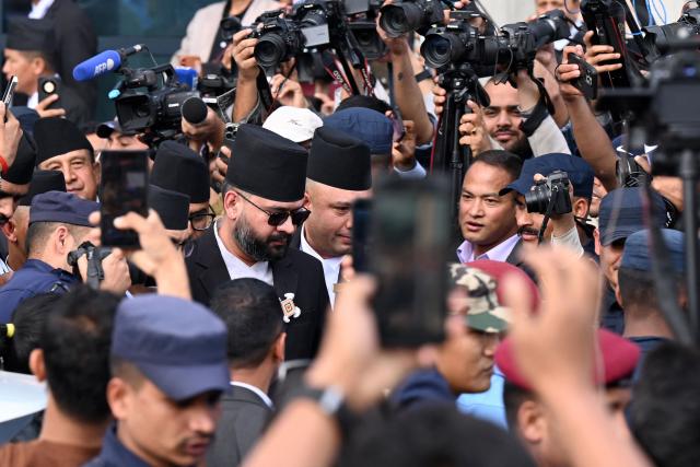 Nepal's newly sworn-in prime minister Balendra Shah (C) leaves after taking oath at the parliament in Kathmandu on March 26, 2026. Four-time prime minister and Marxist leader Oli, 74, was defeated in the polls this month by the 35-year-old rapper-turned-politician Balendra Shah, whose Rastriya Swatantra Party (RSP) won in a landslide after promising to oust an ageing elite, stem corruption and fix the economy. (Photo by PRAKASH MATHEMA / AFP)