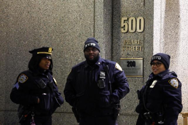 Police officers patrol outside the Daniel Patrick Moynihan United States Courthouse as a convoy believed to be carrying ousted Venezuelan president Nicolas Maduro has arrived for his federal court appearance in Manhattan on March 26, 2026. Lawyers for the ousted Venezuelan president Nicolas Maduro are expected to push for the dismissal of his drug trafficking charges when he appears in a New York court March 26. The Manhattan hearing comes as Washington cautiously warms ties with Caracas, with the question of who will pay the legal fees of the former autocrat and his wife expected to take center stage. (Photo by CHARLY TRIBALLEAU / AFP)