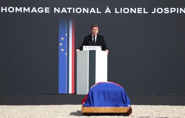 France's President Emmanuel Macron delivers a speech during a national tribute to former French Prime Minister Lionel Jospin at the Hotel des Invalides in Paris on March 26, 2026. Born on July 12, 1937, former French prime minister Lionel Jospin, a Socialist who introduced the 35-hour work week and civil partnerships for gay couples, has died aged 88, his family said on March 23, 2026. (Photo by Ludovic MARIN / POOL / AFP)