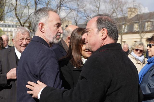 Mayor of Paris Emmanuel Gregoire (L) and Former French President and French MP François Hollande arrive at a national tribute to former French Prime Minister Lionel Jospin at the Hotel des Invalides in Paris on March 26, 2026. Born on July 12, 1937, former French prime minister Lionel Jospin, a Socialist who introduced the 35-hour work week and civil partnerships for gay couples, has died aged 88, his family said on March 23, 2026. (Photo by Ludovic MARIN / AFP)