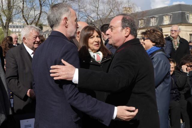 Mayor of Paris Emmanuel Gregoire (L), Former mayor of Paris Anne Hidalgo and Former French President and French MP François Hollande arrive at a national tribute to former French Prime Minister Lionel Jospin at the Hotel des Invalides in Paris on March 26, 2026. Born on July 12, 1937, former French prime minister Lionel Jospin, a Socialist who introduced the 35-hour work week and civil partnerships for gay couples, has died aged 88, his family said on March 23, 2026. (Photo by Ludovic MARIN / AFP)