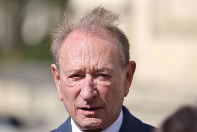Former mayor of Paris Bertrand Delanoë leaves after a national tribute to former French Prime Minister Lionel Jospin at the Hotel des Invalides in Paris on March 26, 2026. Born on July 12, 1937, former French prime minister Lionel Jospin, a Socialist who introduced the 35-hour work week and civil partnerships for gay couples, has died aged 88, his family said on March 23, 2026. (Photo by Ludovic MARIN / AFP)