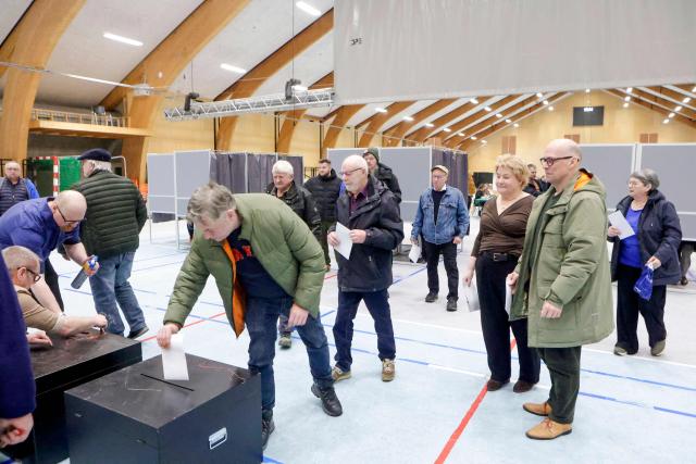 People vote in the election to the Logting, the Parliament of the Faroe Islands, in Torshavn, on March 26, 2026. The Landsstyri, the self-governing government of the Faroe Islands led by the Logmadur, is elected every four years by the Logting. (Photo by Álvur Haraldsen / Ritzau Scanpix / AFP) / Denmark OUT