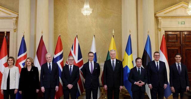 (L-R) Icelandic Prime Minister Kristrun Frostadottir, Latvian Prime Minister Evika Silina, Norwegian Prime Minister Jonas Gahr Store, British Prime Minister Keir Starmer, Finnish President Alexander Stubb, Lithuanian President Gitanas Nauseda, Swedish Prime Minister Ulf Kristersson, Estonian Prime Minister Kristen Michal and Dutch Prime Minister Rob Jetten pose for a family photo at the Joint Expeditionary Force JEF Leaders’ Summit in Helsinki, Finland on March 26, 2026. (Photo by Adrian Dennis / POOL / AFP)