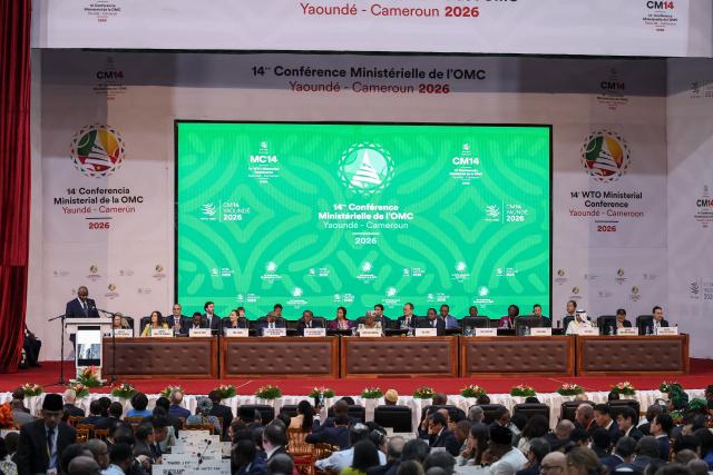 Cameroon's Minister of Trade Luc Magloire Atangana (L) speaks during the WTO ministerial conference in Yaounde on March 26, 2026. (Photo by AFP)