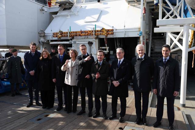 (L-R) Danish Permanent Under-Secretary of State for Foreign Affairs Anders Tang Friborg, Latvian Prime Minister Evika Silina, Estonian Prime Minister Kristen Michal, Icelandic Prime Minister Kristrun Frostadottir, Finnish President Alexander Stubb, Swedish Prime Minister Ulf Kristersson, British Prime Minister Keir Starmer, Norwegian Prime Minister Jonas Gahr Store and Dutch Prime Minister Rob Jetten pose for a group photo onboard the Finnish Border Guard offshore patrol vessel Turva, prior the Joint Expeditionary Force JEF Leaders Summit in Helsinki, Finland on March 26, 2026. The topics on the agenda include support from the JEF countries to Ukraine and the overall security situation in Europe. (Photo by Adrian DENNIS / POOL / AFP)