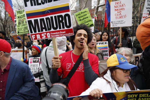 Supporters of ousted Venezuelan president Nicolas Maduro protest outside the Daniel Patrick Moynihan United States Courthouse in New York City on March 26, 2026. Lawyers for the ousted Venezuelan president Nicolas Maduro are expected to push for the dismissal of his drug trafficking charges when he appears in a New York court March 26. The Manhattan hearing comes as Washington cautiously warms ties with Caracas, with the question of who will pay the legal fees of the former autocrat and his wife expected to take center stage. (Photo by John Lamparski / AFP)