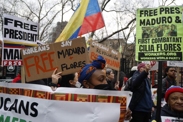 Supporters of ousted Venezuelan president Nicolas Maduro protest outside the Daniel Patrick Moynihan United States Courthouse in New York City on March 26, 2026. Lawyers for the ousted Venezuelan president Nicolas Maduro are expected to push for the dismissal of his drug trafficking charges when he appears in a New York court March 26. The Manhattan hearing comes as Washington cautiously warms ties with Caracas, with the question of who will pay the legal fees of the former autocrat and his wife expected to take center stage. (Photo by John Lamparski / AFP)