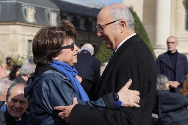 Former Minister and former First Secretary of the Socialist Party Martine Aubry (L) speaks with Former French Prime Minister Laurent Fabius as they arrive at a national tribute to former French Prime Minister Lionel Jospin at the Hotel des Invalides in Paris on March 26, 2026. Born on July 12, 1937, former French prime minister Lionel Jospin, a Socialist who introduced the 35-hour work week and civil partnerships for gay couples, has died aged 88, his family said on March 23, 2026. (Photo by Ludovic MARIN / AFP)