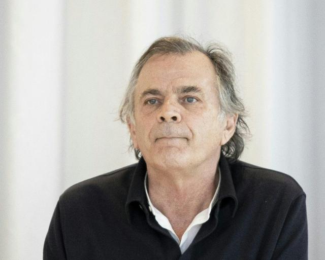 In this photo taken on November 17, 2023, in Vienna, Artistic Director Markus Hinterhaeuser reacts during a presentation of a new production of "Jedermann" by Hugo von Hofmannsthal. The Salzburg Festival and its artistic director Markus Hinterhaeuser are parting ways with immediate effect due to irreconcilable differences, the Festival Board announced in a statement on March 26, 2026. The Salzburg Festival is considered one of the world’s most important festivals of opera, drama and classical concerts; this year’s edition will take place from July 17 to August 30, 2026. (Photo by TOBIAS STEINMAURER / APA / AFP) / Austria OUT