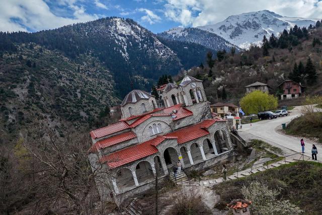 Aerial view shows the Greek Orthodox Church of the Dormition of the Virgin Mary, after a massive landslide in April 2012 moved the entire structure several metres downhill where it rested tilted at 17 degrees, in the village of Ropoto, central Greece, on March 22, 2026. (Photo by Will VASSILOPOULOS / AFP)
