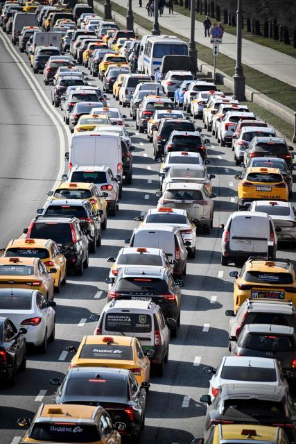 Cars stuck in a traffic jam in central Moscow on March 26, 2026. (Photo by Alexander NEMENOV / AFP)