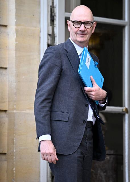 France's Economy, Finances and Industry Minister Roland Lescure arrives to attend a meeting on wartime economy at the French Prime minister official residence Hotel Matignon in Paris on March 26, 2026. (Photo by JULIEN DE ROSA / AFP)
