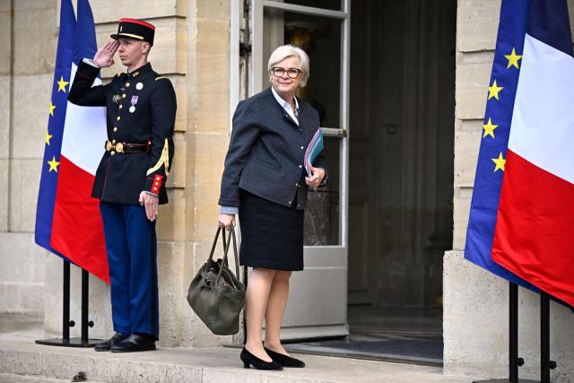 France's Defence Minister Catherine Vautrin arrives to attend a meeting on wartime economy at the French Prime minister official residence Hotel Matignon in Paris on March 26, 2026. (Photo by JULIEN DE ROSA / AFP)