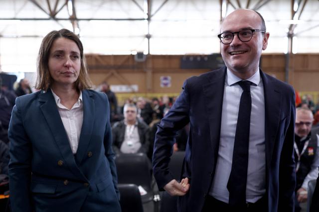 French trade union General Confederation of Labour (CGT) Secretary General Sophie Binet (L) and France’s junior Minister for Industry Sebastien Martin take part in the CGT ‘Made in France’ conference in Pont-de-Claix, central-eastern France, on March 26, 2026. (Photo by Alex MARTIN / AFP)