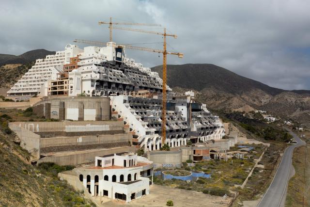 The unfinished Algarrobico Hotel inside Cabo de Gata Natural Park is seen in this aerial view in Carboneras, near Almeria on March 26, 2026. (Photo by JORGE GUERRERO / AFP)