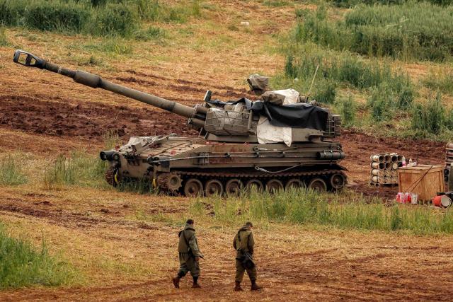 An Israeli self-propelled howitzer artillery gun is positioned in the upper Galilee in northern Israel near the border with southern Lebanon on March 26, 2026. Lebanon was drawn into the Middle East war on March 2, when pro-Iran Hezbollah launched rockets towards Israel in response to US-Israeli strikes that killed Iranian supreme leader on February 28. (Photo by Jack GUEZ / AFP) / 