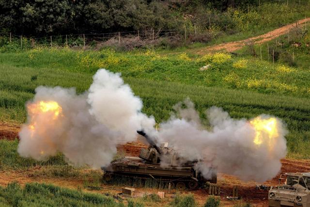 An Israeli self-propelled howitzer artillery gun fires rounds towards southern Lebanon from a position in the upper Galilee in northern Israel near the border on March 26, 2026. Lebanon was drawn into the Middle East war on March 2, when pro-Iran Hezbollah launched rockets towards Israel in response to US-Israeli strikes that killed Iranian supreme leader on February 28. (Photo by Jack GUEZ / AFP) / 