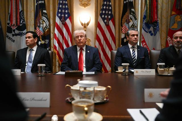 US President Donald Trump hosts a cabinet meeting in the Cabinet Room of the White House on March 26, 2026. Also pictured, from L-R, US Secretary of State Marco Rubio, US Secretary of Defense Pete Hegseth and US Secretary of Commerce Howard Lutnick. (Photo by Jim WATSON / AFP)