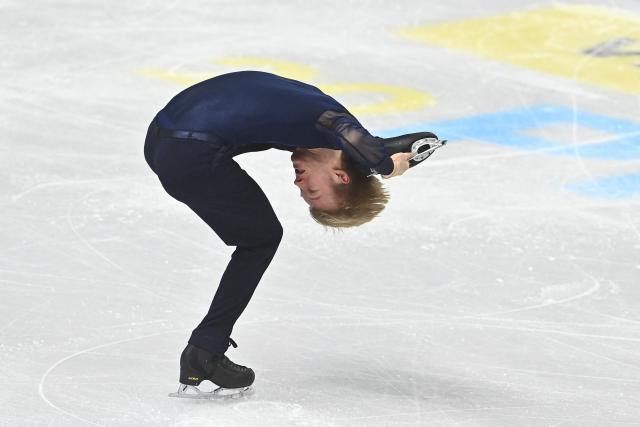 Daniel Grassl from Italy performs during the men's short program at the 2026 ISU World Figure Skating Championships in Prague on March 26, 2026. (Photo by Michal Cizek / AFP)
