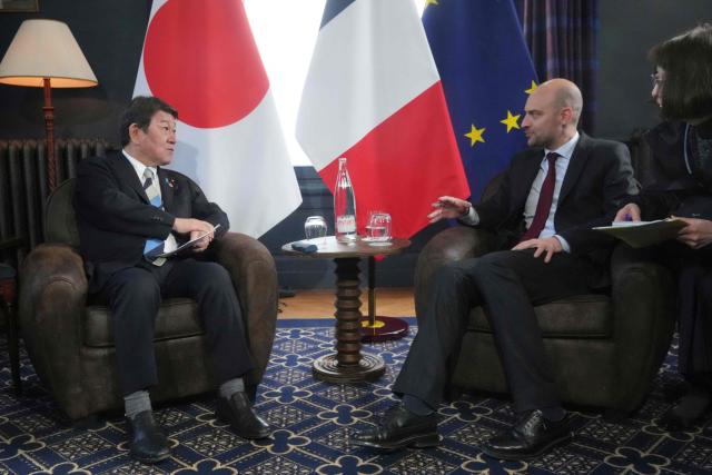 Japan's Foreign Affairs Minister Motegi Toshimitsu (L) speaks with France's Foreign Affairs Minister Jean-Noel Barrot during a bilateral meeting on the sidelines of the G7 Foreign Ministers' meeting with Partner Countries at the Vaux-de-Cernay Abbey in Cernay-la-Ville outside Paris, on March 26, 2026. Foreign ministers from the G7 will take part part in a two-day meeting with European nations and allies seeking to narrow differences with the US on the Middle East war while keeping other crises like Ukraine and Gaza high on the agenda. (Photo by Michel Euler / POOL / AFP)