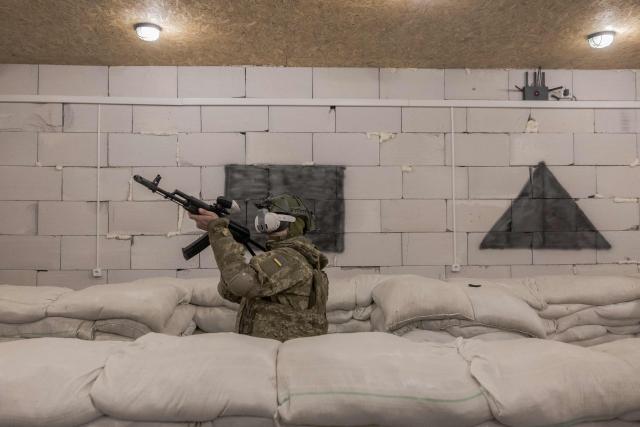 A Ukrainian recruit using VR headsets completes basic military training at the Ukrainian Ground Forces training center in an undisclosed location on March 25, 2026, amid the Russian invasion of Ukraine. (Photo by Roman PILIPEY / AFP)