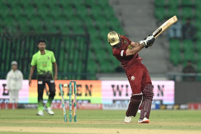 Hyderabad Kingsmen's Pakistani all-rounder Hammad Azam (R) is clean bowled by Lahore Qalandars' Pakistani bowler Ubaid Shah (not pictured) during the Pakistan Super League (PSL) Twenty20 match between Lahore Qalandars and Hyderabad Kingsmen at Gaddafi Stadium in Lahore on March 26, 2026. (Photo by Arif ALI / AFP)
