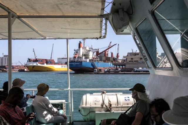 The bulk carrier Truong Minh Prosperity (C), sailing under the flag of Panama, is seen moored at Autonomous Port of Dakar in Dakar, on March 26, 2026. (Photo by PATRICK MEINHARDT / AFP)