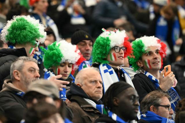 Italy's supporters are pictured before the play-off FIFA World Cup 2026 European qualification semi-final football match between Italy and North Ireland at the Gewiss stadium in Bergamo, on March 26, 2026. (Photo by Alberto PIZZOLI / AFP)