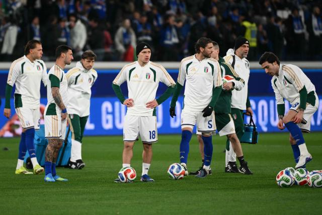 Italy's midfielder #18 Nicolo Barella warms up with teammates before the play-off FIFA World Cup 2026 European qualification semi-final football match between Italy and North Ireland at the Gewiss stadium in Bergamo, on March 26, 2026. (Photo by Alberto PIZZOLI / AFP)