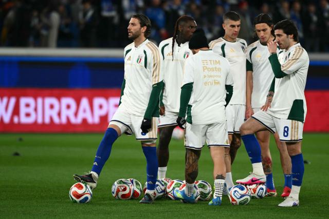 Italian players warm up before the play-off FIFA World Cup 2026 European qualification semi-final football match between Italy and North Ireland at the Gewiss stadium in Bergamo, on March 26, 2026. (Photo by Alberto PIZZOLI / AFP)